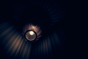 Close up view of beautiful modern brown ceiling lamp