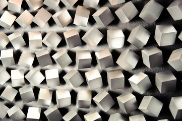 Close up of silver tridimensional cubes on gray fabric
