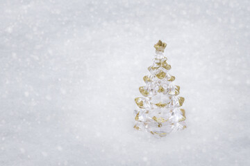 Christmas decoration in the form of Christmas spruce on pure white snow. High quality photo