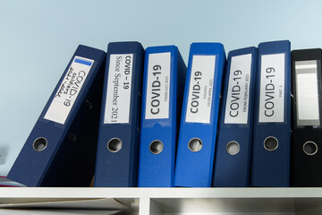 Shelves are full with folders and files of medical record, patient information