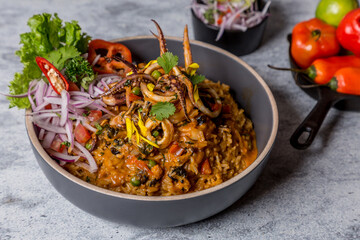 mix of seafood with rice bell pepper lettuce on gray marble