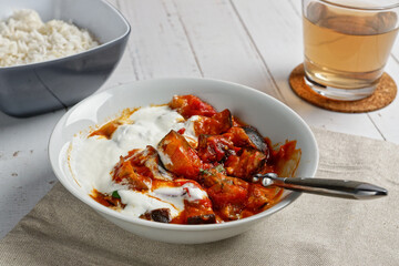 Eggplant curry with tomatoes and yogurt. Table top.