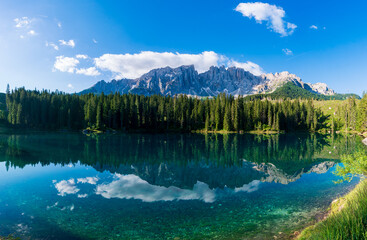 bleu lake in the dolomites Italy, Carezza lake Lago di Carezza, Karersee with Mount Latemar,...