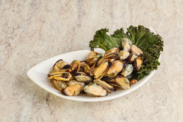 Tasty marinated mussels in the bowl
