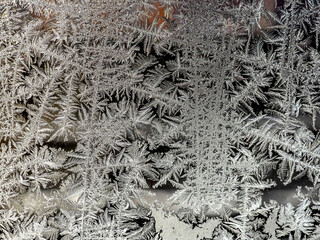 beautiful frosty patterns on the window glass