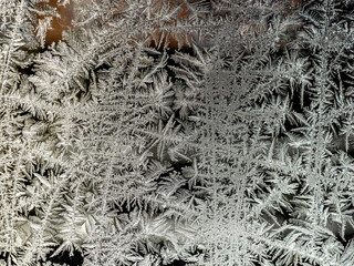 beautiful frosty patterns on the window glass
