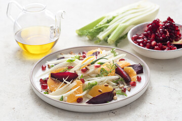 Salad with fennel, oranges, beets and pomegranate seeds with sauce