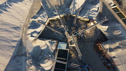 aerial view of sand dunes within the factory for the production of concrete and asphalt for roads, quality industrial material