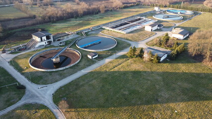 Aerial view of a wastewater treatment plant. During purification, chemicals and microorganisms are...