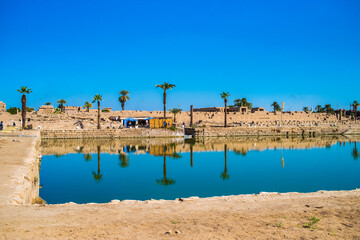  EGYPT - KARNAK TEMPLE - Large sculptures of pharaohs inside beautiful Egyptian landmark with...