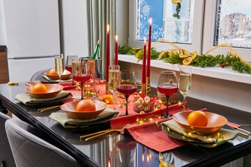 Elegant New Year's table with glasses of wine and candles