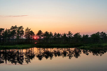 gorgeous sunset on a bog lake in estonia