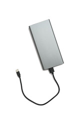 Universal external battery - powerbank in a metal case and a USB cable, isolated on white with a shadow