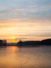 Naklejka premium sunset over the river