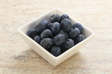 Sweet ripe blueberry heap in the bowl