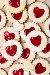 Linzer cookies in shape of heart with jam on light background. Mother's day, Women's day, Valentine's day. Homemade present.