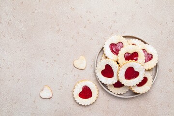 Linzer cookies in shape of heart with jam on light background. Mother's day, Women's day,...
