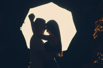 Two lovers isolated silhouette on white, studio shooting