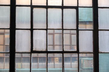 Industrial windows with steel frames and colorful glass