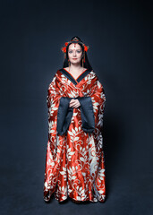 Beautiful young woman in red traditional Chinese costume