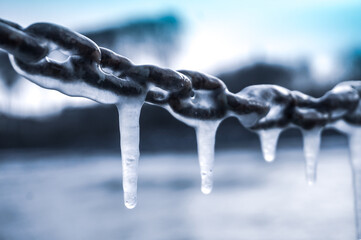 Icicles hanging on a chain - frost, winter concept - obrazy, fototapety, plakaty