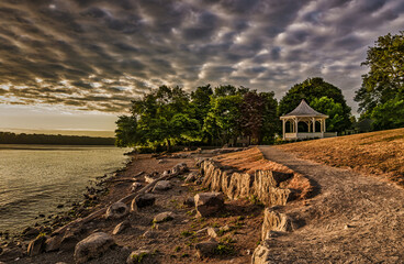 A lakeside path leads to the historic NOTL gazebo seen on an early summer morning with dramatic...