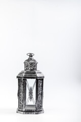 Beautiful vintage metal lantern on a white background