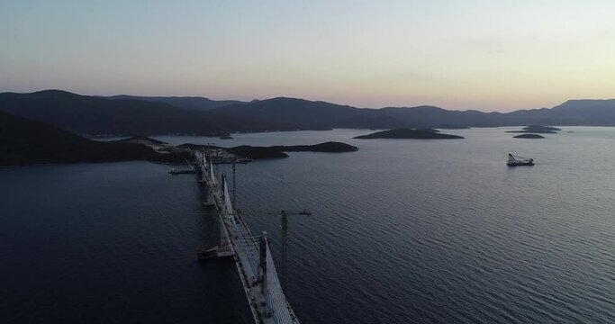 Aerial view of Peljeski bridge, a suspended railroad and highway under construction crossing the Bay of Mali Ston in Croatia.