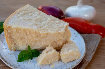 Cheese collection, piece of matured cow cheese pasmesan parmigiano reggiano made from cow milk