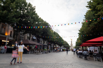 Obraz premium Walking on streets in central part of old French city Reims with famous champagne houses, France