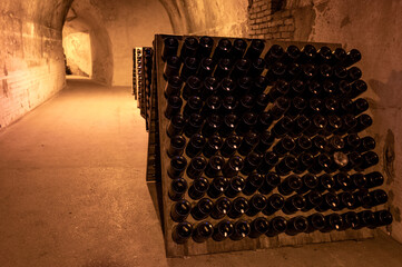 Deep and long undergrounds caves for making champagne sparkling wine from chardonnay and pinor noir grapes in Reims, Champagne, France