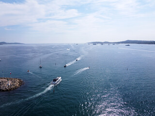 Obraz premium Aerial view on blue water of Gulf of Saint-Tropez and sailboats near Port Grimaud and port Cogolin, French Riviera, Provence, France