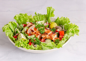 Chicken Salad of Lettuce, Cucumber, Onion and Tomato. Healthy Lunch Menu