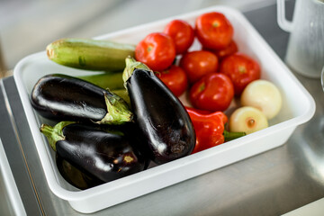 view of the white tray with fresh colorful vegetables