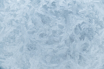 Frost pattern on a window. Frosen window texture.