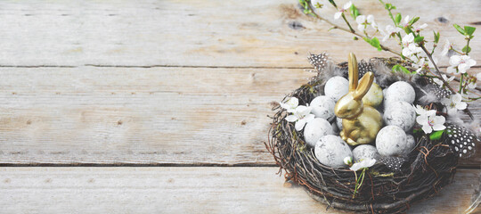 eggs in a basket on a wooden table - easter backgrounders banner	

