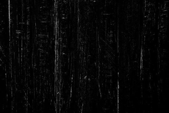 Random scratches texture on a black metal surface for background