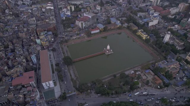 Aerial view looking down at Rani Pokhari in Kathmandu Nepal at dusk.