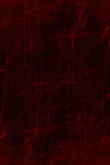 Abstract red grunge texture background of vertical cement plaster wall with random scratches