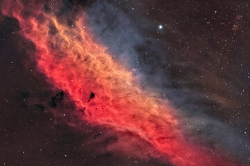 The California Nebula (NGC 1499) is an emission nebula located in the constellation Perseus. It is so named because it appears to resemble the outline of the US State of California. - 478599833