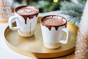 Cups of Hot Chocolate in a festive decoration, excellent illustration of warm drink for celebration and comfort 