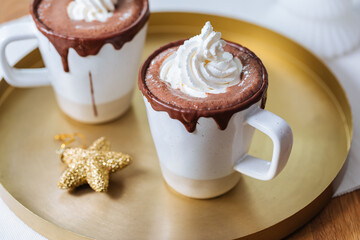 Cups of Hot Chocolate in a festive decoration, excellent illustration of warm drink for celebration and comfort 