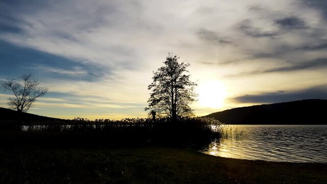  Aerial Drone - Sunset landscape on Lake Corgeno.