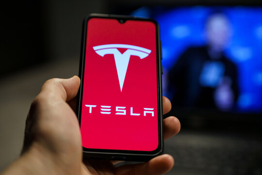 Tesla Model Pi smartphone. Phone made by Elon Musk company Tesla. Tesla logo on smartphone screen