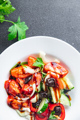 vegetable salad tomato, cucumber, olives, onion, pepper fresh spring healthy meal food snack on the table copy space food background