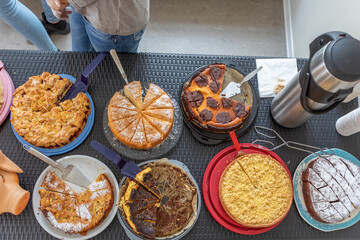 different cakes and pies are on a table