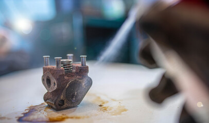 cleaning the EGR valve with a cleaner spray, exhaust gas recirculation valve.