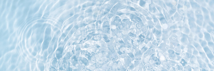 Banner of watery blue and clean surface with ripple effect and circles from drops, top view....
