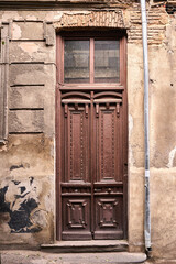 A brown wood old door on the georgian street