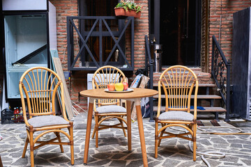 Old chairs and table stand on the street in the street in europe